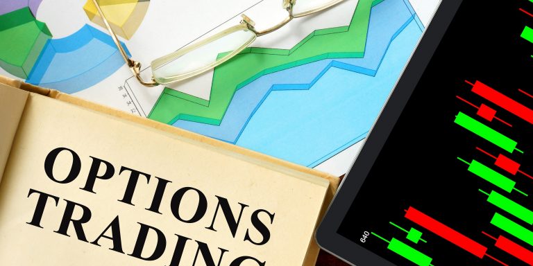 Words options trading written on a book. Business concept.