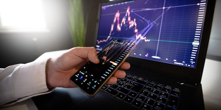 Businessman trading online stock market concept or forex investment exchange. Bitcoins, futures. Crypto currency chart with values moving up and down, trading statistics and analytics on laptop screen forex background Binar. stockbroker. checking price chart on digital exchange. Forex trading agency worker agent reviewing profits growth. Another crisis is coming and prices on the charts are falling down. finance business stock exchange graph chart, crypto, blockchain data analytics report analyzing. business man working on financial report. Stock Trading Option